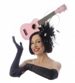 Image of woman wearing a pink ukulele as a hat