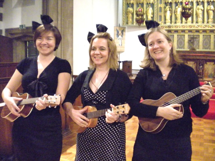 Niccola, Sara Dennis and Heather with ueks and big bows in their hair like Mickey Mouse ears